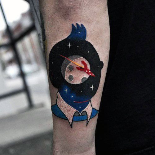 Creative tattoo of a stylized character with a galaxy in place of the head, featuring a red spaceship flying across a planet.
