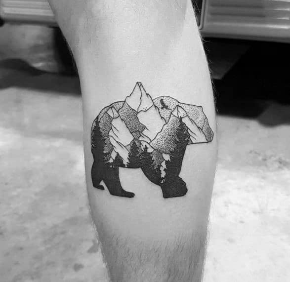 Blackwork tattoo of a bear silhouette filled with detailed mountain peaks and forest trees, blending wildlife and nature themes.