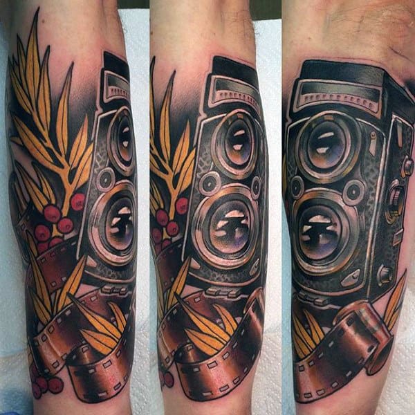 Double Lens Camera And Reel Tattoo Male Forearms