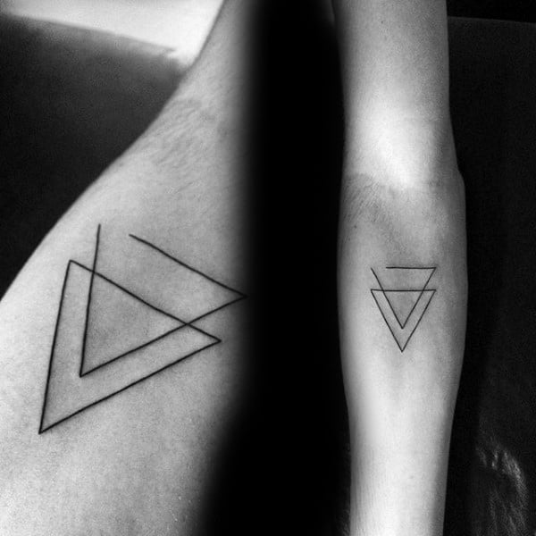 Geometric tattoos of an overlapping triangle and an inverse triangle with lines on an arm