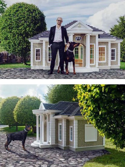 A luxury dog house resembling a large mansion, featuring classic architecture with columns, windows, and a detailed roof design, with a person and dog standing beside it