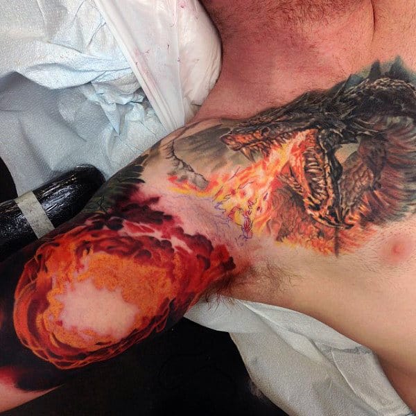 Dragon Breathing Fireball Mens Chest And Inner Arm Tattoos