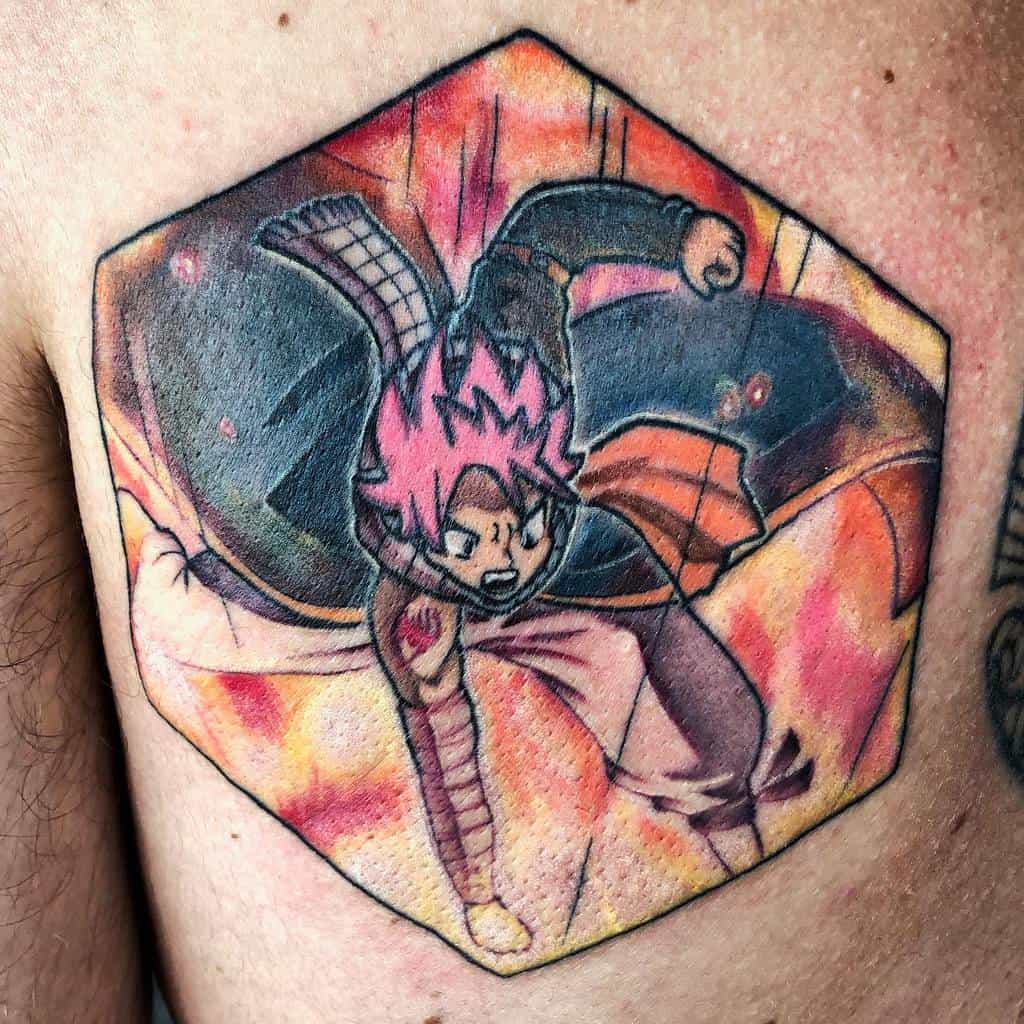 Dynamic tattoo of Natsu Dragneel from Fairy Tail in an action pose, featuring bold colors, fiery effects, and a hexagonal frame for added depth.