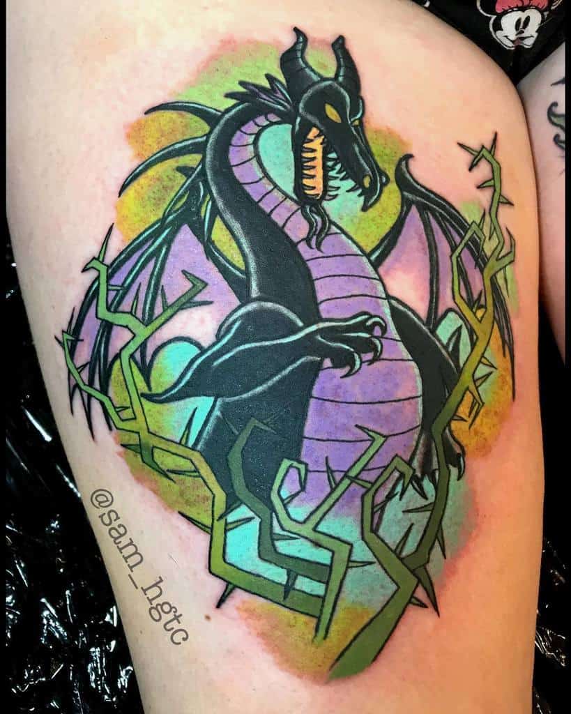 Vibrant tattoo of Maleficent's dragon with bold purple and black tones, surrounded by green thorns and a mystical watercolor background