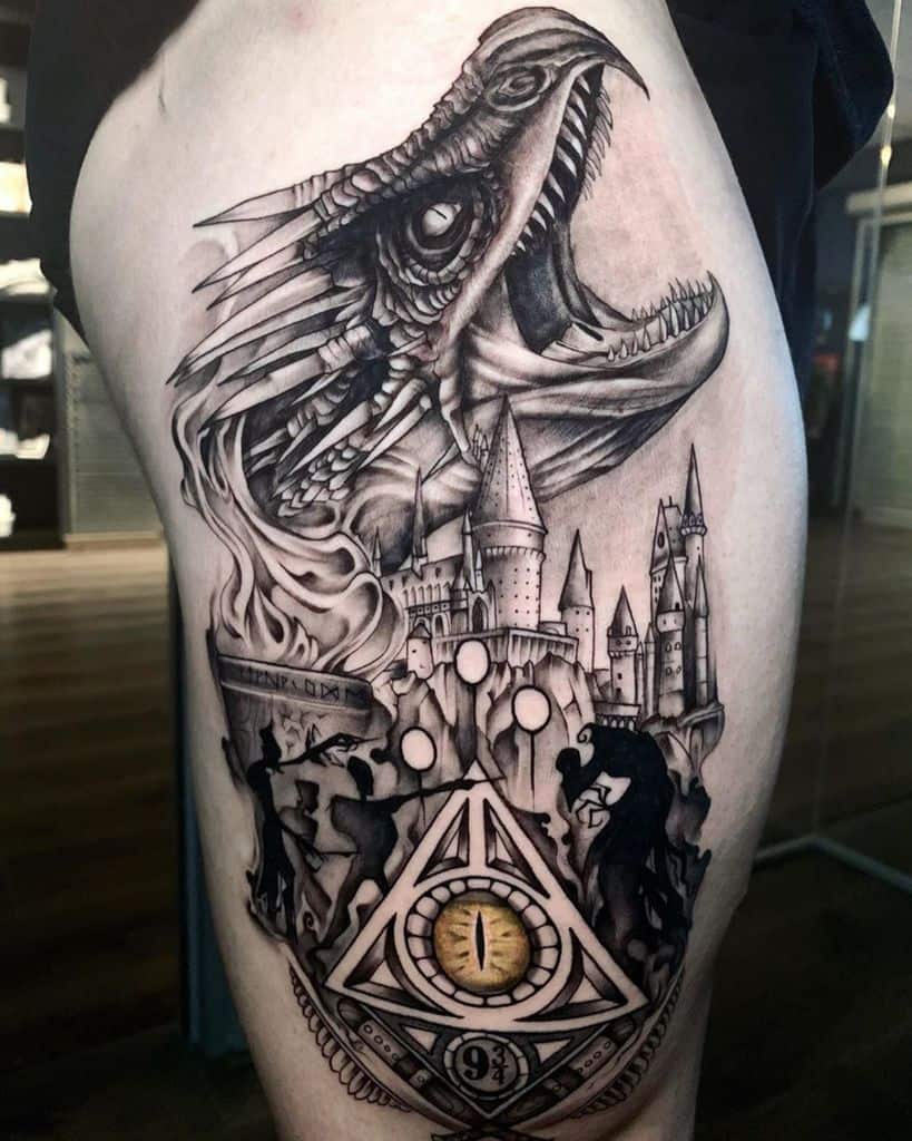 Intricate Harry Potter tattoo featuring a roaring dragon, Hogwarts castle, Dementors, the Deathly Hallows symbol, and a platform 9¾ compass.