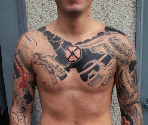 Man with chest and arm tattoos featuring a horse, wings, and a round symbol