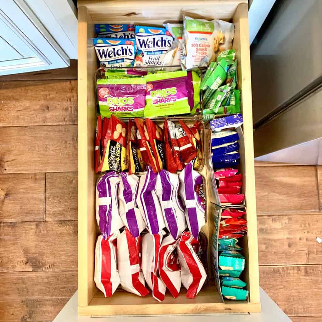 pull-out drawer divider with snacks