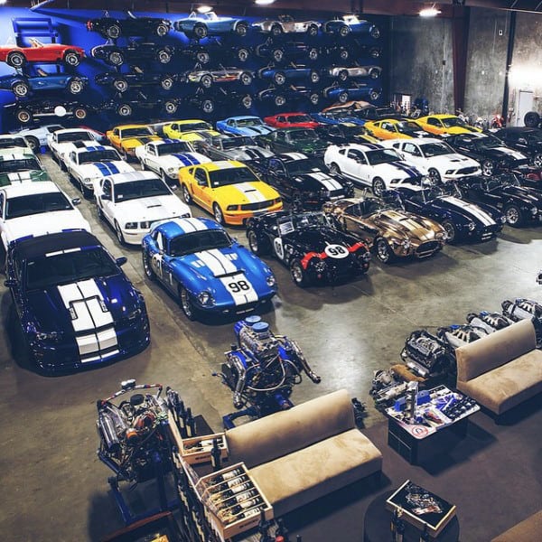 A vast dream garage showcasing a stunning collection of classic and exotic cars.