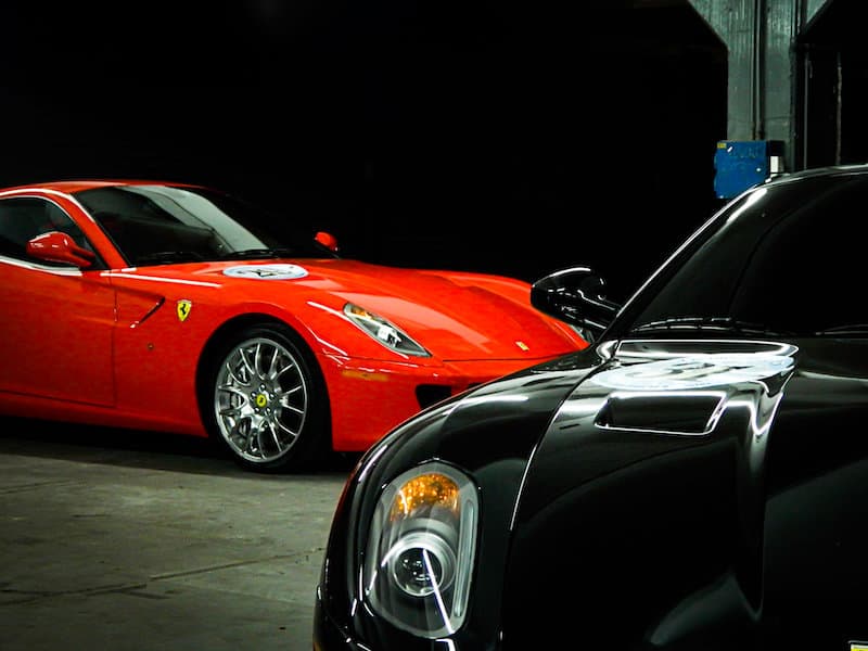 red and black sports cars in garage