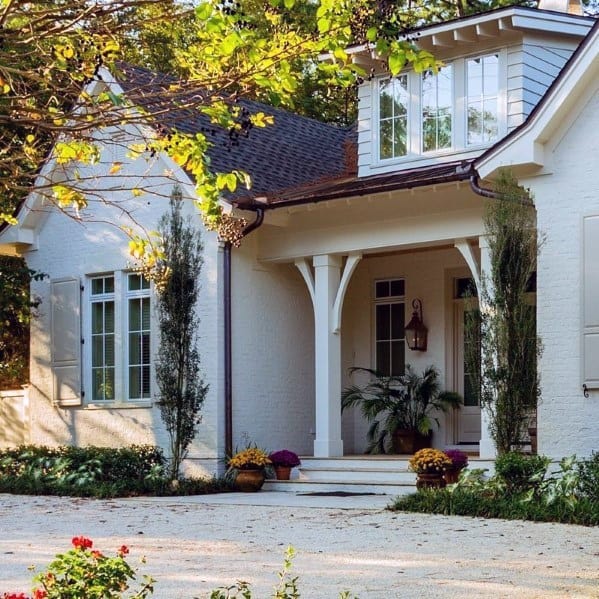 Gravel driveway with a clean, natural look complementing a charming cottage-style home.