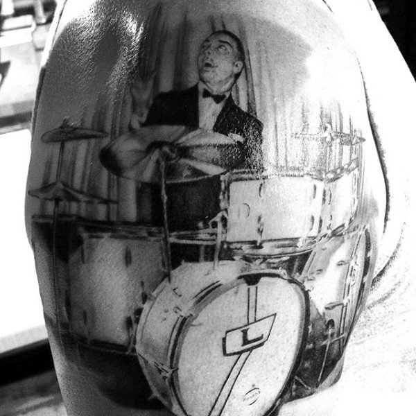 Drummer Playing Mens Upper Arm Tattoo With Realsitic Design