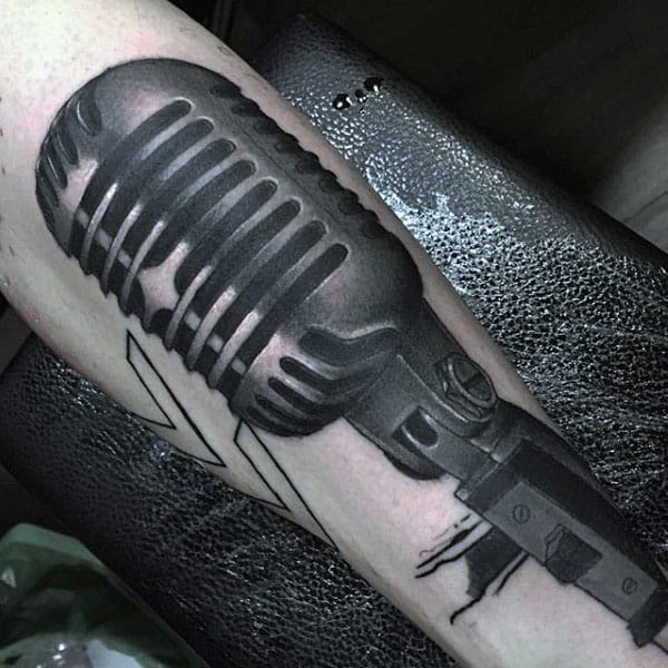Dusty Black Microphone Tattoo Guys Forearm
