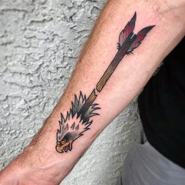 Colorful broken arrow tattoo with red and yellow gradient shaft, paired with a fierce eagle head below, symbolizing strength and survival.