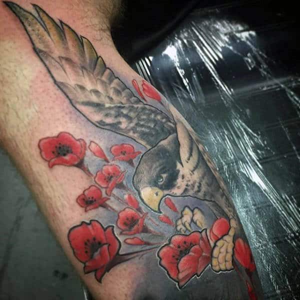 Eagle With Red Poppy Flowers Tattoo On Bicep For Men