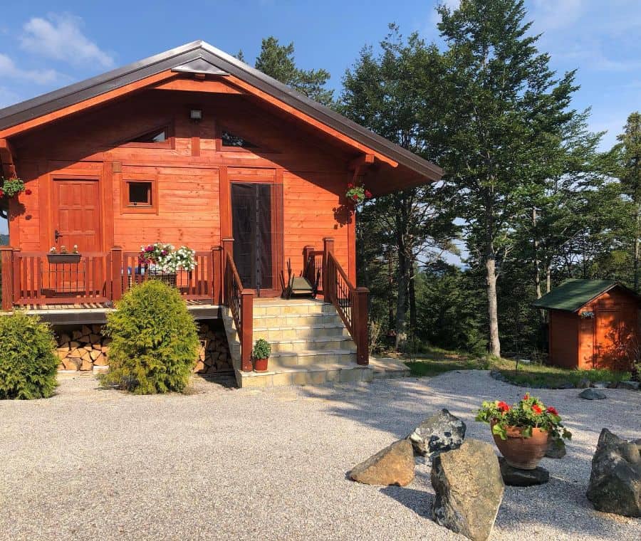 red wood cabin gravel front yard 