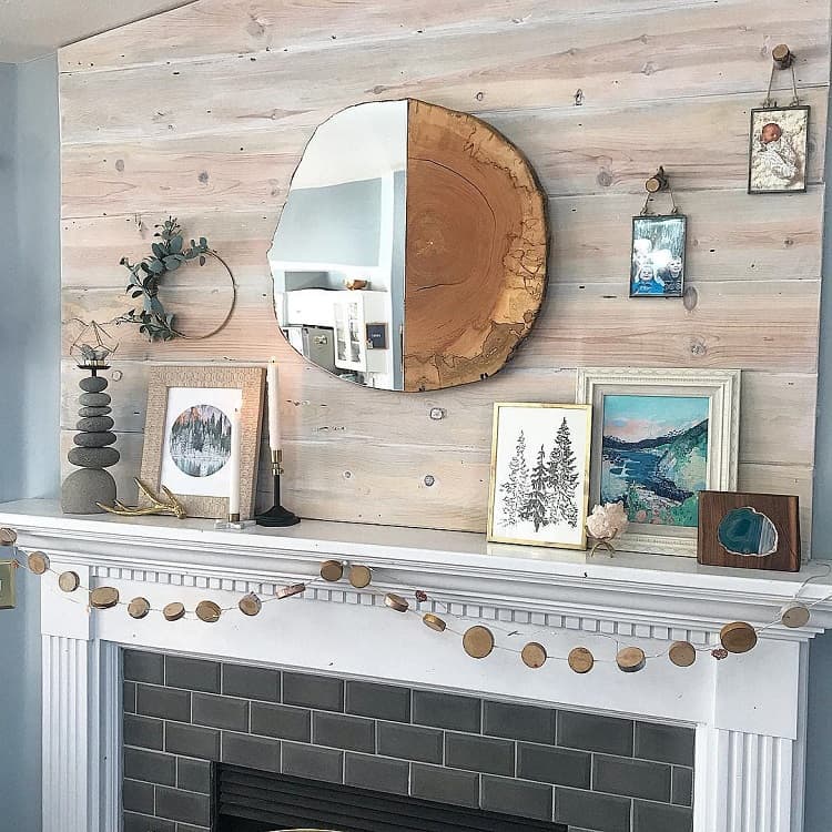stone fireplace with log wall mirror
