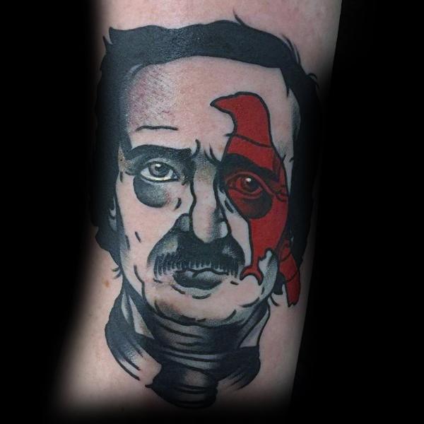 Bold neo-traditional Edgar Allan Poe tattoo with half his face in grayscale and a red raven overlaying one eye for a dramatic contrast.