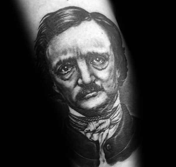 Detailed black and grey tattoo of Edgar Allan Poe with expressive eyes, deep shading, and a melancholic, haunting gaze.