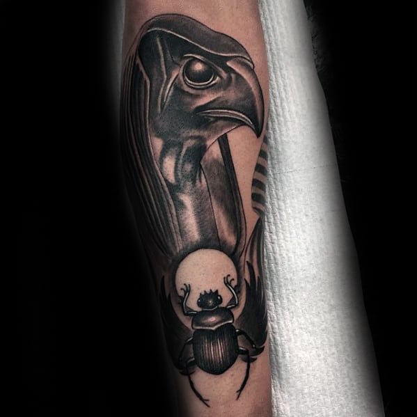 egyptian bird with scarab guys outer forearm tattoos