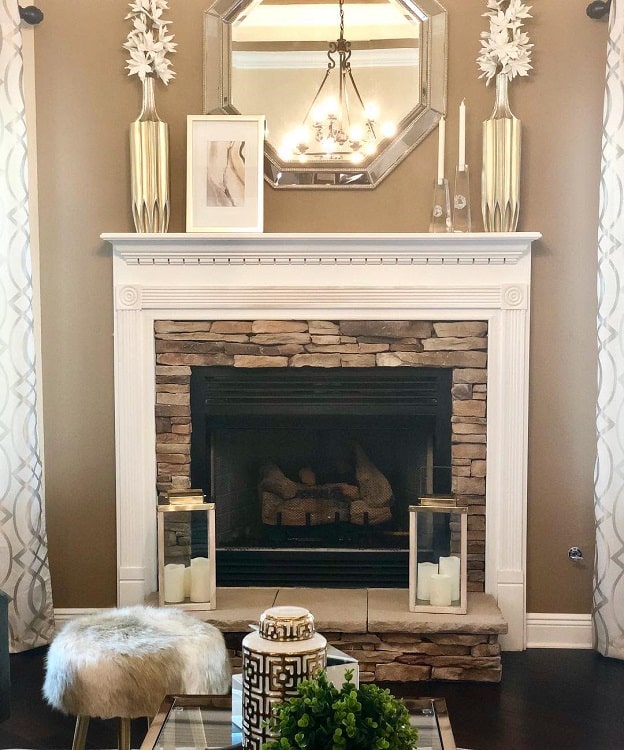 modern stone fireplace with white mantel