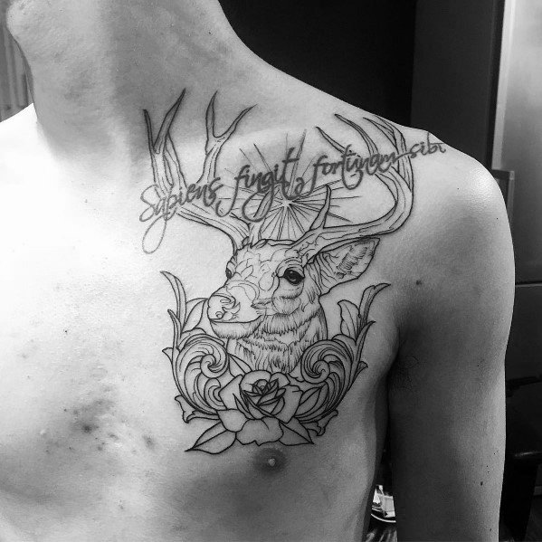 Black and grey elk chest tattoo with ornate floral details and script, featuring fine linework for an elegant and symbolic design.