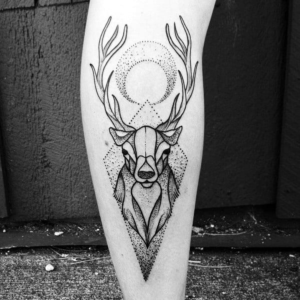 Minimalist geometric elk tattoo on the calf, featuring fine linework, dot shading, and a celestial design for a modern and elegant look.