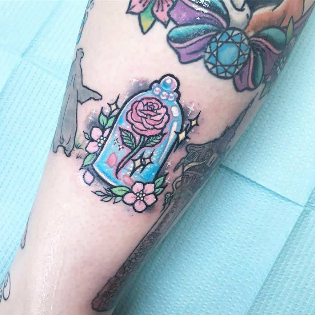 Whimsical tattoo of the enchanted rose inside a glass dome, surrounded by pastel flowers and sparkles, in a soft, colorful style.