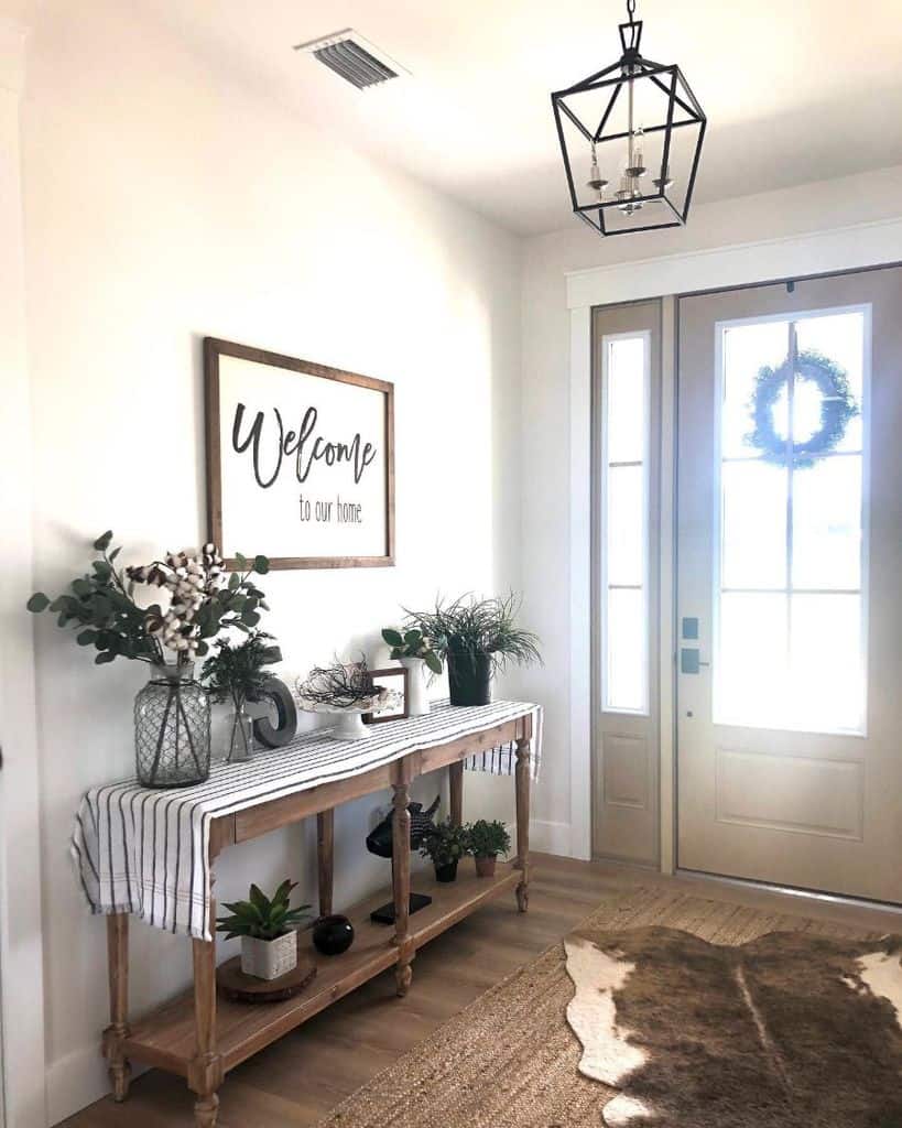 farmhouse entryway with rustic cabinet
