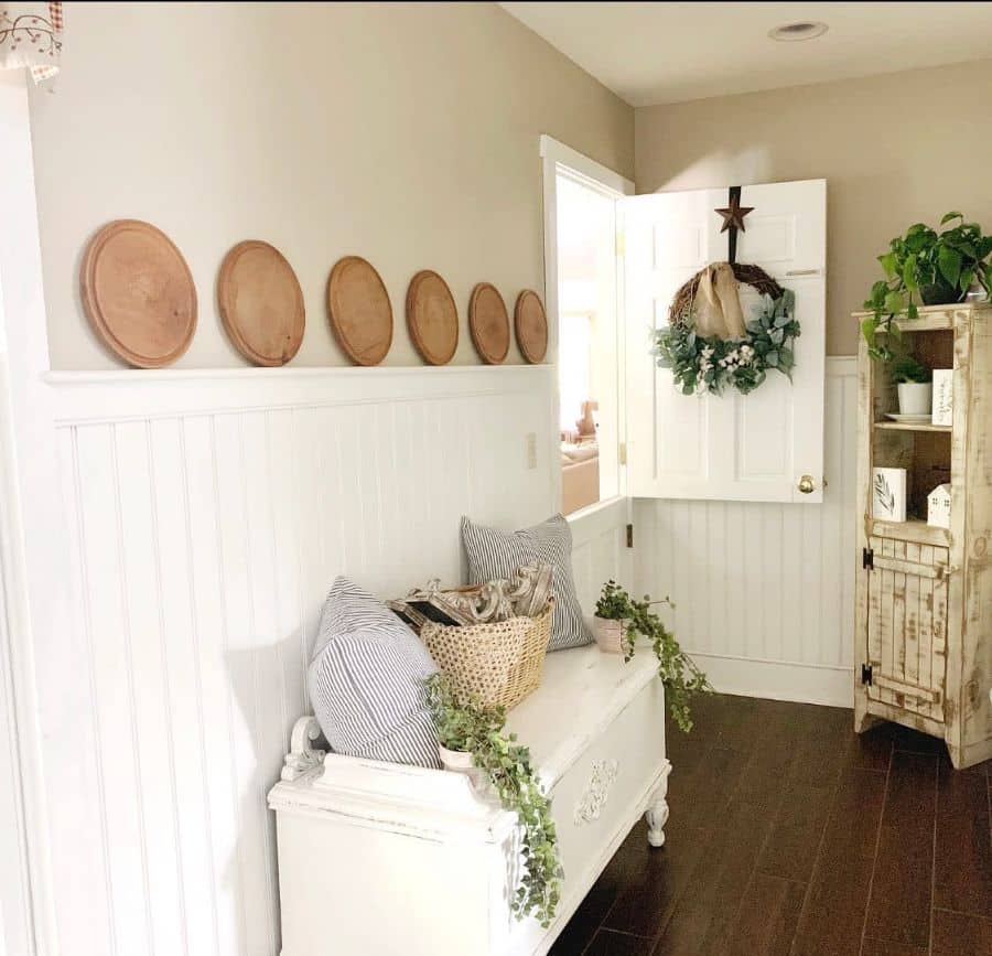 small white shiplap wall living room with vintage chest and cabinet