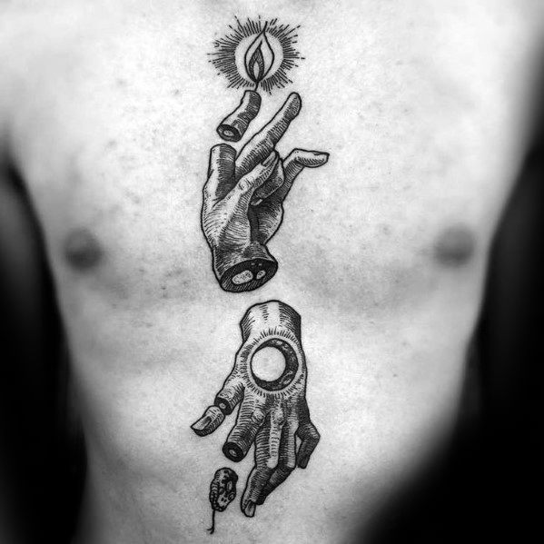 Tattoo of two severed hands, one holding a lit candle with an eye in the flame, the other with a circular void and a small head below.