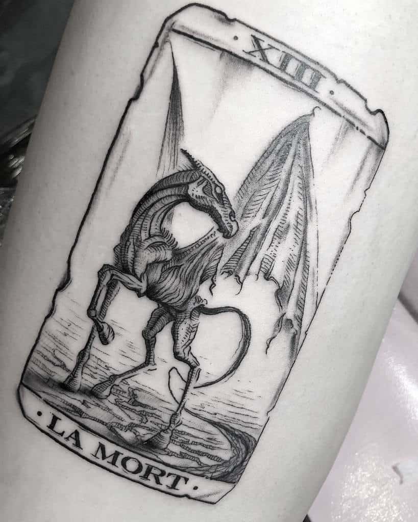 Intricate black ink tattoo of a Thestral on a tarot card labeled 'La Mort' with Roman numeral XIII