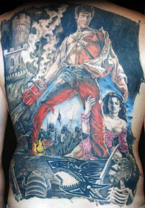 Epic full-back Evil Dead tattoo of Ash standing heroically with chainsaw and shotgun, surrounded by skeletons, castle ruins, and chaos.