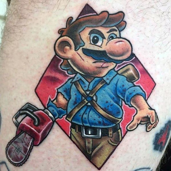 Funny Evil Dead tattoo of Mario dressed as Ash, complete with chainsaw hand, shotgun, and blue shirt in a bold cartoon style.