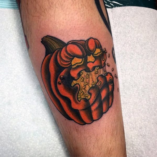 Evil Pumpkin With Seeds In Mouth Mens Leg Tattoo