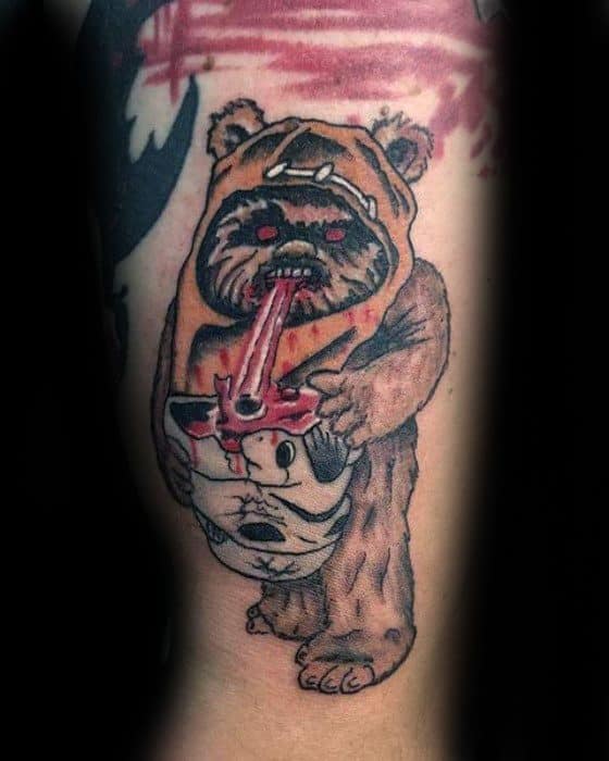 Dark-humor Ewok tattoo with glowing red eyes, holding a Stormtrooper helmet and licking blood off a bone with a menacing look.