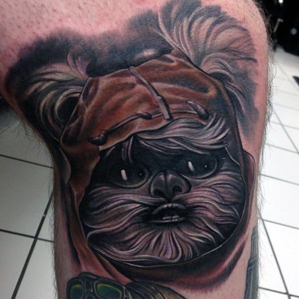 High-contrast Ewok tattoo with deep shading and intense detail, showcasing expressive eyes and a hood with realistic fur texture.