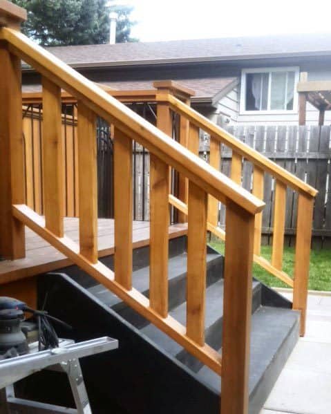 stained wood deck railing stairs