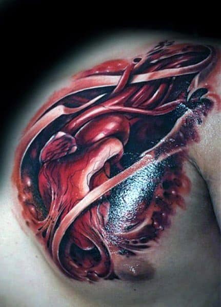 Realistic 3D tattoo of an anatomical heart on the shoulder, featuring exposed veins and torn flesh, creating a bold and intense biomechanical effect.