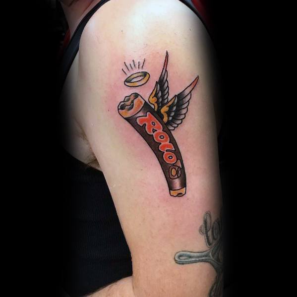 Creative Rolo candy tattoo with angel wings and a halo, symbolizing a "sweet departure," blending humor and bold illustrative style.