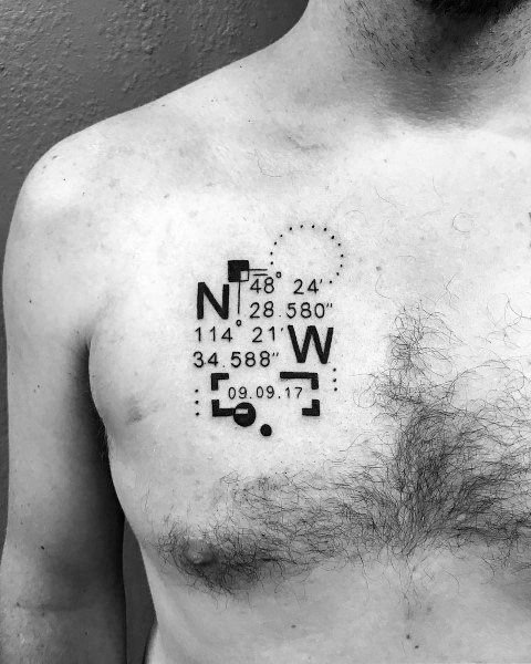 Modern geometric coordinate tattoo on the chest with bold black elements, numbers, and a date box, symbolizing a meaningful location and moment.