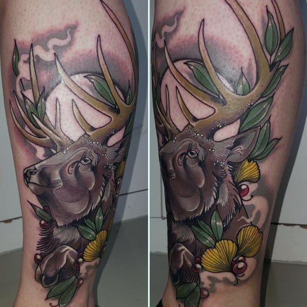 Vibrant neo-traditional elk tattoo on the leg, featuring bold colors, detailed antlers, and botanical elements for a striking and artistic design.