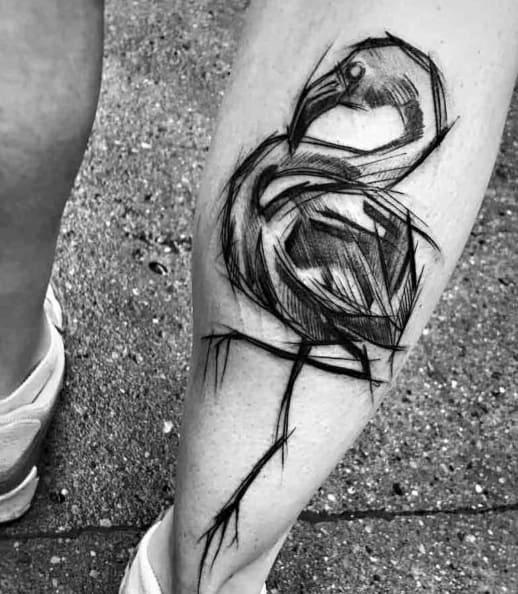 Sketch-style flamingo tattoo in black ink, featuring rough, artistic lines and a raw, hand-drawn aesthetic for a bold and edgy look.