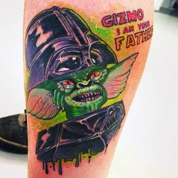 Gremlin tattoo fused with Darth Vader, featuring a dark helmet, glowing red eyes, and 'Gizmo, I am your father' text for a fun twist.