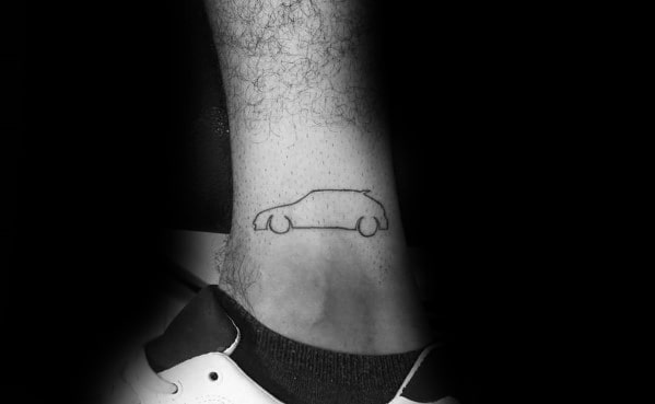 Minimalist Honda car outline tattoo on a man's ankle, featuring a simple and clean design.