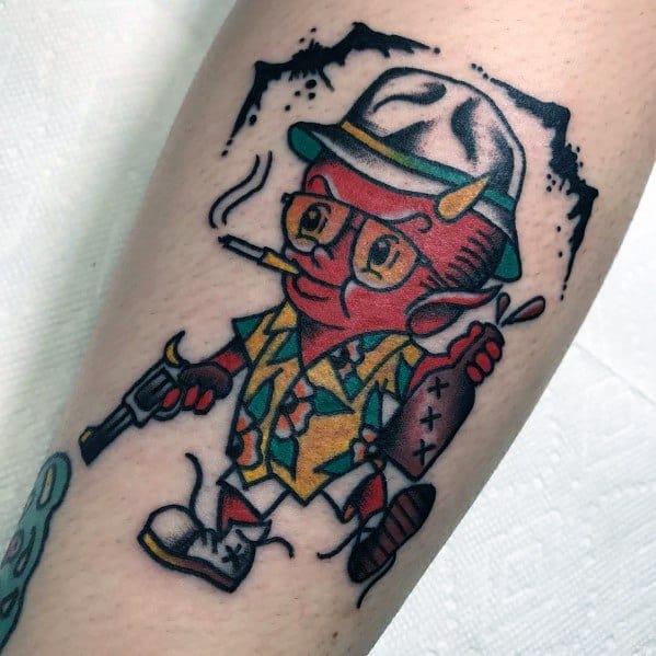 Cartoon-style Hunter S. Thompson tattoo featuring a stylized character with a bucket hat, aviator glasses, cigarette, gun, and tropical shirt.