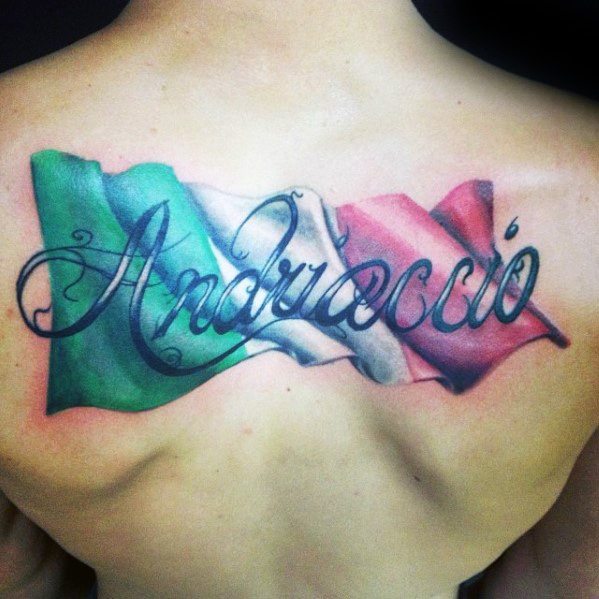 Back tattoo featuring a waving Italian flag with the name "Andrieccio" elegantly scripted across it, symbolizing heritage and identity.