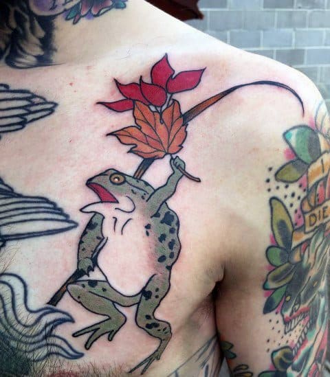 Japanese-style chest tattoo featuring a dynamic frog holding a red maple leaf on a staff, surrounded by traditional wave and floral elements.