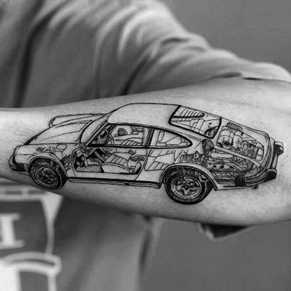 Detailed Porsche tattoo with cutaway design on a man's forearm, highlighting intricate car components.