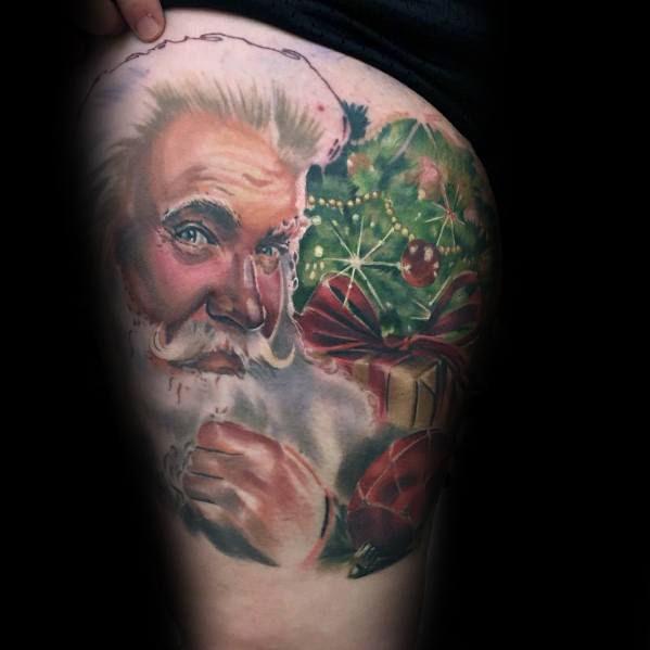 Realistic Santa Claus tattoo with a festive touch, featuring detailed shading, twinkling eyes, and a Christmas tree adorned with ornaments and gifts.