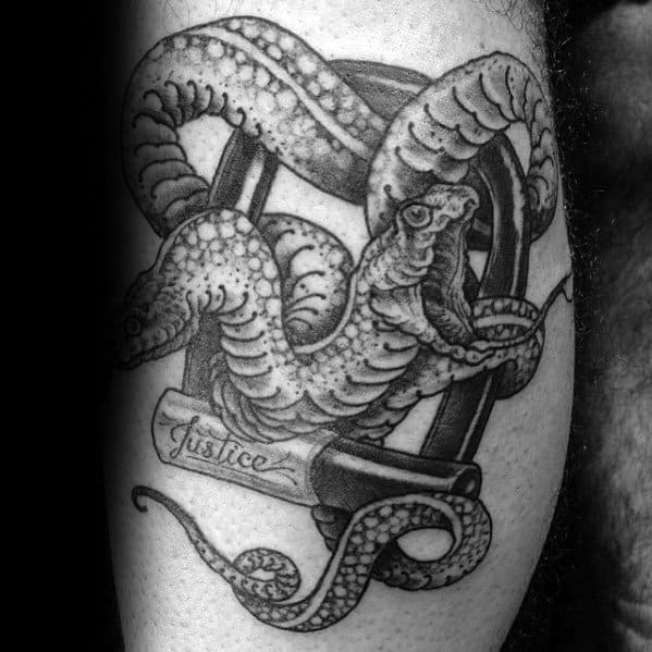 Black and grey two-headed snake tattoo wrapped around a gavel, with "Justice" inscribed, symbolizing power and authority in a bold design.